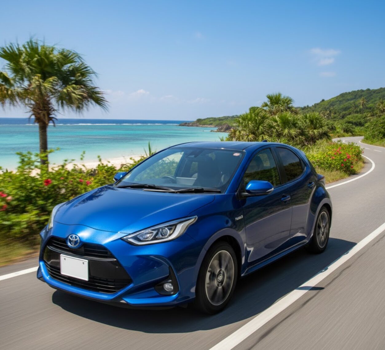 沖縄の海岸線沿いの道路で、青いヤリスハイブリッド（またはアクア）を運転する日本人ドライバーの目線で描かれた、燃費の良いコンパクトカーのイメージ。運転席から見える景色は開放的な海。